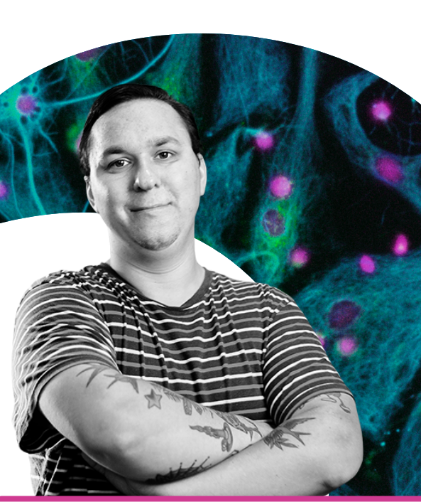 Portrait of a man with tattoos on his arms in front of a background of green cells